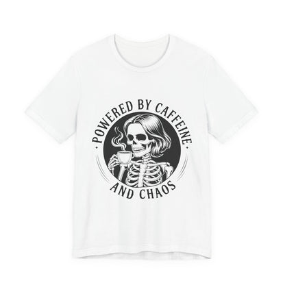 Powered by Caffeine and Chaos skeleton drinking coffee t-shirt in detailed ink style on a light tee