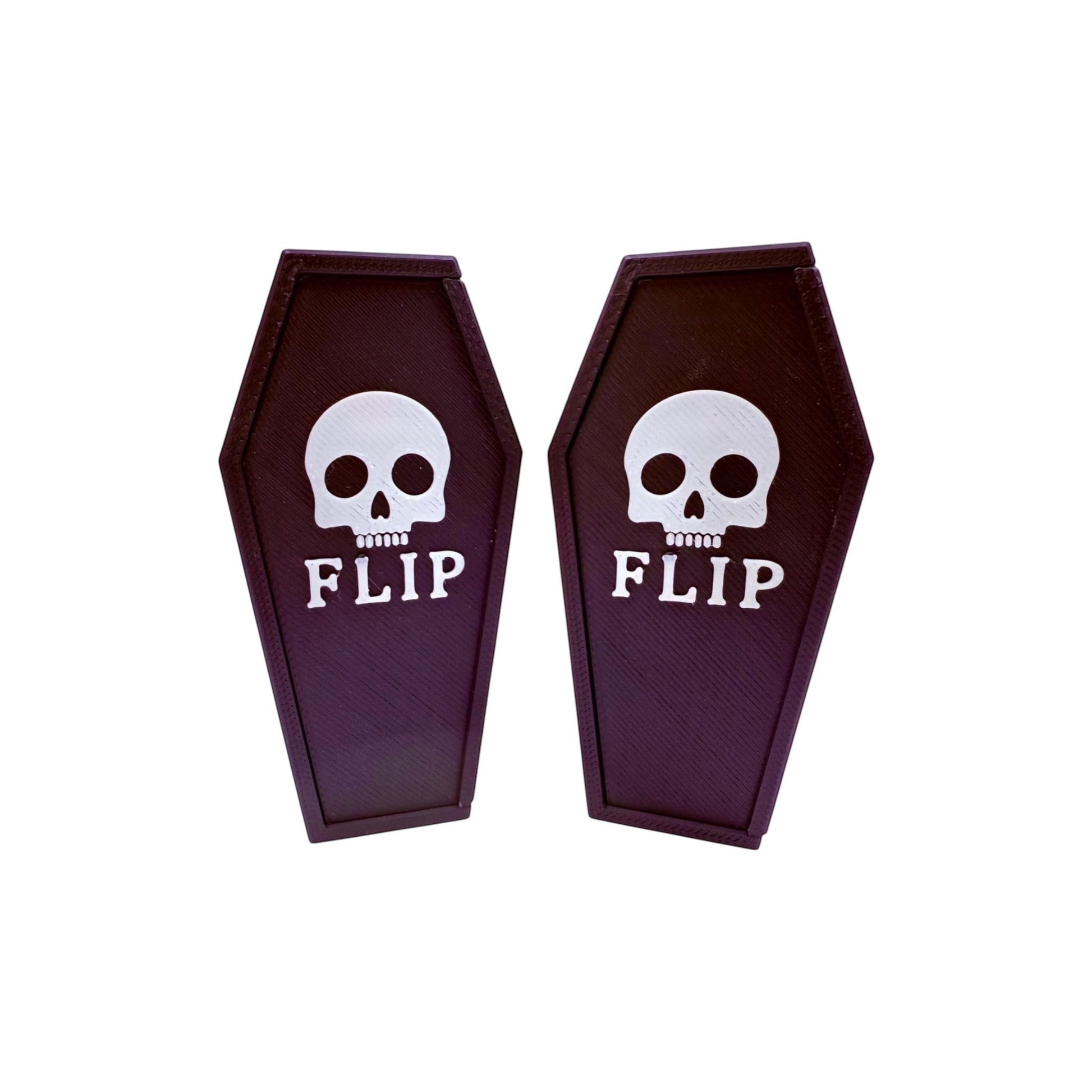 Wacky McLovin Prints coffin-shaped fingerboard display case with skull and FLIP graphic. Gothic style.